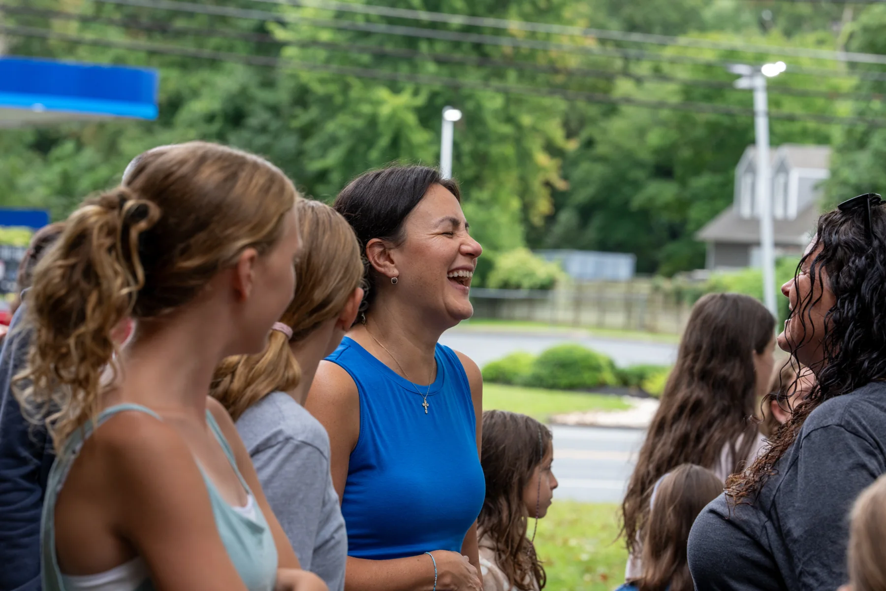 Guests smiling and chatting outside the studio